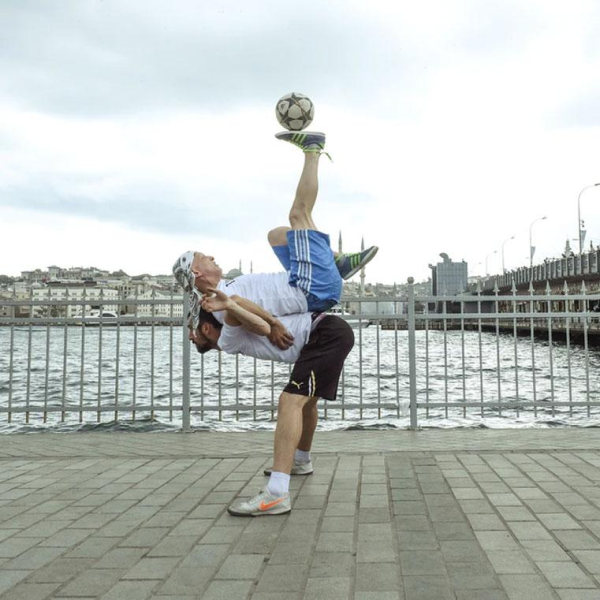 Two people play football